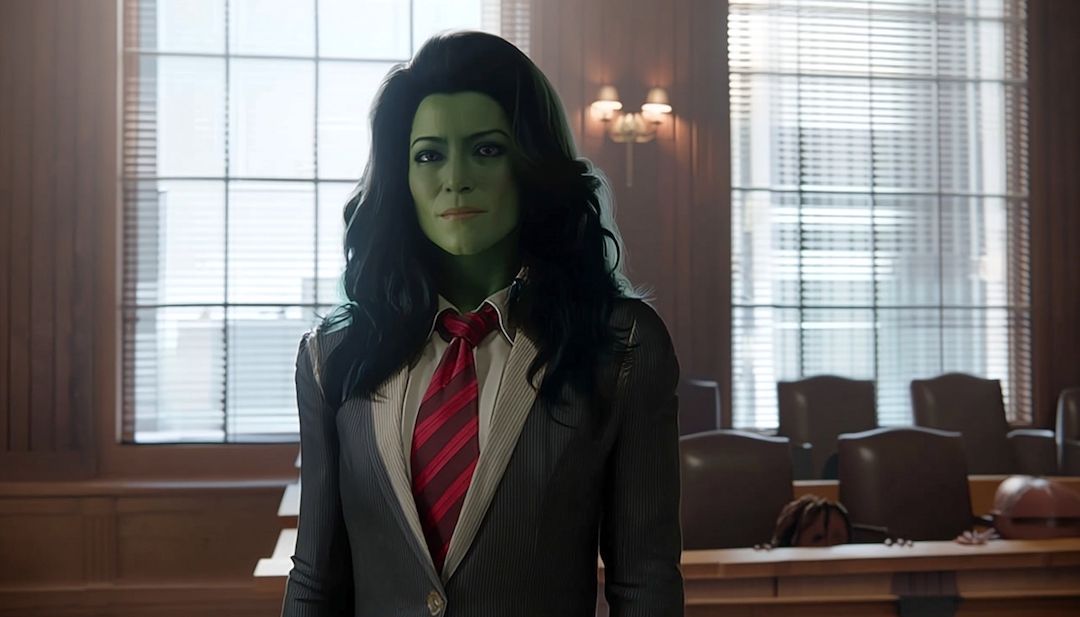 She-Hulk in lawyer attire showing sharp-tongued defender personality among Avengers types.